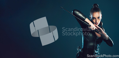 Image of Woman, warrior and vigilante in cosplay with sword on mockup for battle, war or game against dark studio background. Portrait of female in black hero costume with blade for superhero halloween outfit