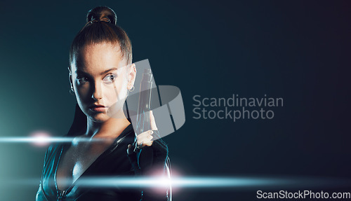 Image of Woman, gun and assassin costume in studio with mock up space for action, movie promo and branding. Girl, pistol and mockup for logo, brand and promotion with model ninja, danger and future aesthetic