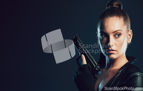 Image of Woman, vigilante and gun in serious war, battle or agent standing ready for mission on mockup. Female spy holding weapon for secret operation, objective or cosplay against a dark studio background