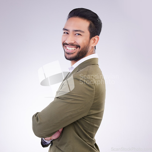 Image of Happy, crossed arms and portrait of business man in studio for success, confidence mindset and leadership. Corporate manager, ceo and male entrepreneur smile on white background in professional suit