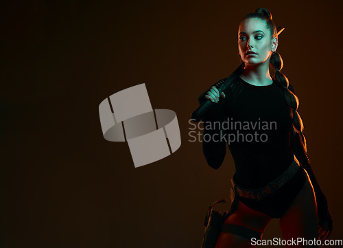 Image of Warrior, woman and sword with space in studio for action, fight and safety from danger. Strong female vigilante, assassin or agent in scifi cosplay costume with weapon for mockup dark background