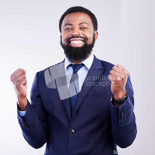 Image of Yes, winner portrait and business black man isolated on gray background celebration for opportunity, bonus or winning. Happy person, fist pump and celebrate corporate promotion or job news in studio