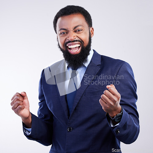 Image of Yes, winner face and business black man isolated on gray background in celebration for opportunity, bonus or winning. Happy person, fist pump and celebrate corporate promotion or job news in studio