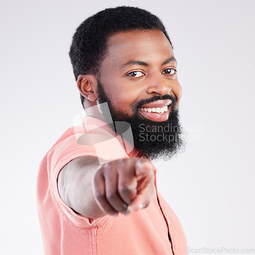Image of Point, smile and portrait of black man in studio with hand gesture for motivation, encouragement and selection. Happy, mockup and male on white background pointing for choice, advertising or decision