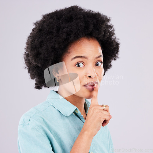 Image of Portrait, secret and black woman with finger on lip, silence and girl against a studio white background. Face, African American female and lady with gesture on mouth for quiet, whisper and gossip