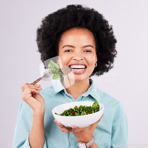 Image of Salad, healthy food and portrait of a black woman in studio eating vegetables for nutrition or vegan diet. Happy African female with a smile for health, detox and wellness benefits for motivation