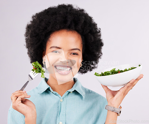 Image of Health, salad and smile portrait of a black woman in studio eating vegetables for nutrition or vegan diet. Happy African female with fork for healthy food, detox and wellness benefits for motivation