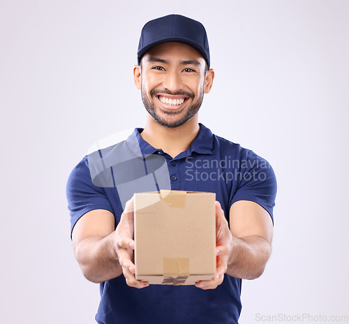 Image of Delivery, box and portrait of asian man in studio for shipping, courier and supplier. Logistics, product and cargo with male on gray background for ecommerce, postage and package distribution