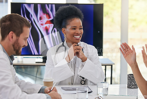 Image of Medical meeting, black woman doctor and healthcare team with doctors networking. X ray research, happy and collaboration of a health and wellness group in clinic office for diagnosis strategy