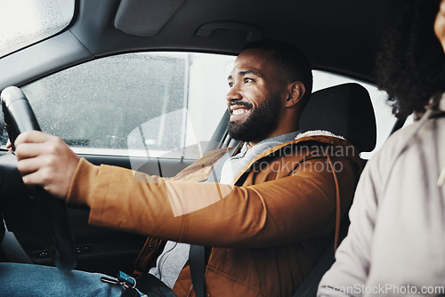 Image of Man driving, rain and smile in city with car journey, winter travel and happiness for road trip. Guy driver, transportation and urban adventure with safety, vacation or holiday with excited face