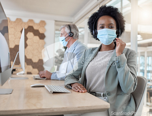 Image of Portrait, call center and woman with covid compliance, face mask and job safety in office workspace. African telecom agent, consultant or person with health advice, insurance and virtual tech support