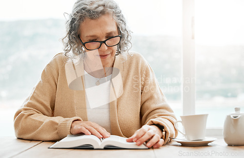 Image of Old woman reading book, story or bible to relax in hobby or retirement for peace or learning religion. Elderly studying or calm senior person with novel for information or knowledge on table at home