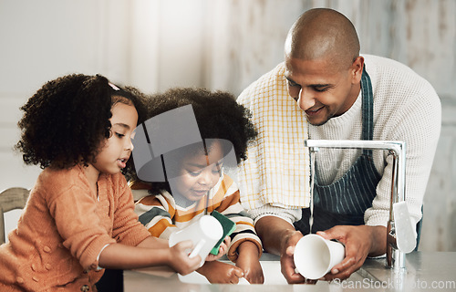 Image of Happy, cleaning and father with children in kitchen for bonding, hygiene or teaching. Smile, support and chores with black family washing dishes at home for sanitary, responsibility or housekeeping