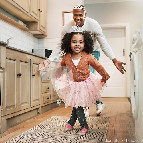 Image of Child, parent ballet dance and portrait of a girl and father together bonding with dancing in the kitchen. Home, kid and dad with love and care in a house playing a dancer game for children fun