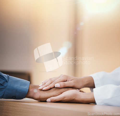 Image of Holding hands, support and health with doctor and patient, cancer diagnosis and empathy with comfort for people. Trust, helping hand with hospital advice or medical results with healthcare insurance