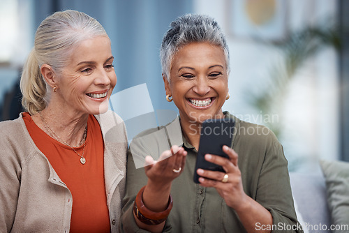 Image of Elderly women smile, phone social media and living room with senior females on web mobile. Video streaming, happiness and conversation at a house with old people together on technology at home