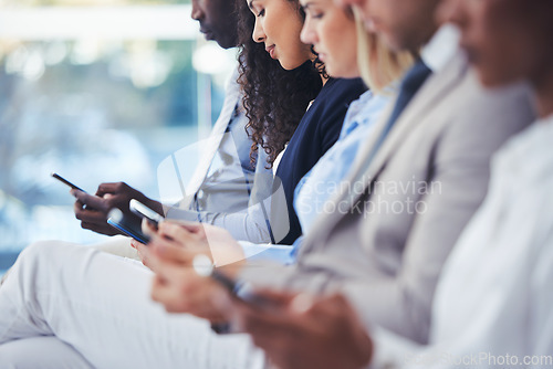 Image of Business people, hiring and hands with phone in waiting room for networking, social media or communication at office. Group of employee workers wait in line or row with smartphone on recruitment app