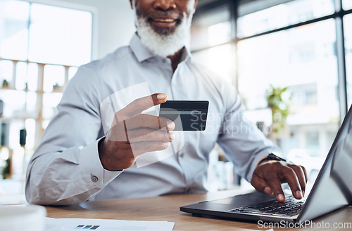 Image of Hands of black man, business credit card and laptop for ecommerce, finance or accounting in office. Worker, computer and financial payment of budget, fintech trading or banking of investment economy