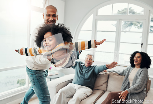 Image of Airplane, playful and happy with family in living room for bonding, affectionate and support. Games, balance and weekend with father carrying child at home for free time, flying and laughing