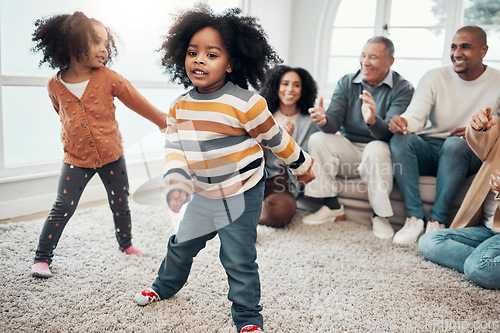 Image of Big family, children dancing and living room with parents, grandparents or love with applause in home. Kids, men and women with dance, smile or happiness for brother, sister and together on holiday