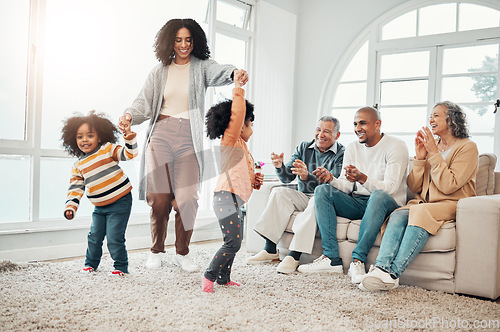 Image of Happy family, playing and mother having fun with children in a home in winter and bonding together in a vacation house. Parents, grandparents and mom play with kid during a holiday getaway