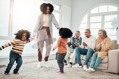 Image of Family, playing and mom having fun with children in a home in winter and bonding together in a vacation house. Parents, grandparents and happy mother play with kid during a holiday getaway