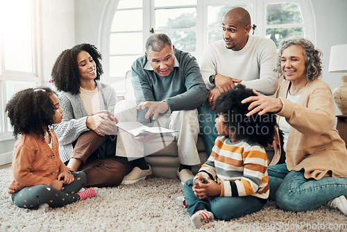 Image of Family relax, generations with fantasy and reading book, grandparents with parents and kids at home for storytelling. Animation, entertainment and surprise, happy people bonding with love and care
