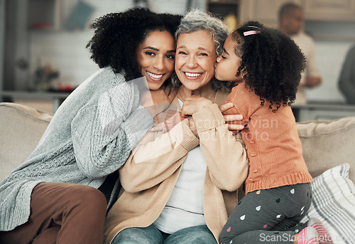 Image of Kiss, portrait and grandmother with girl and woman on a sofa, hug and happy in their home together. Kissing, face and excited senior woman with adult daughter and grandchild on couch, bond and smile