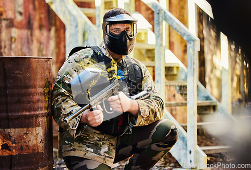 Image of Paintball, portrait or male soldier with gun in shooting game playing on fun training battlefield mission. Man or focused warrior with army weapons gear for survival in military challenge competition