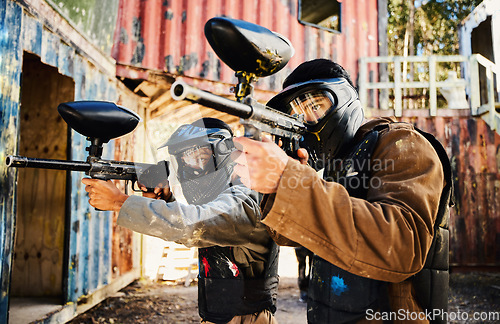 Image of Paintball, target training or men with guns in shooting game with teamwork on fun army battlefield mission. Focused male soldiers aim war weapons for fighting or group survival in military challenge