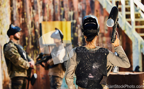 Image of Paintball, back view or woman with gun in game or competition for fitness, exercise or cardio workout. War soldier, challenge or female warrior with army weapon or marker for military target training