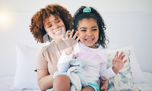 Image of Love, mother and girl in bedroom, playing and quality time together with happiness, bonding and loving. Family, mama or daughter on bed, smile or relax on weekend, break and fun with joy and cheerful