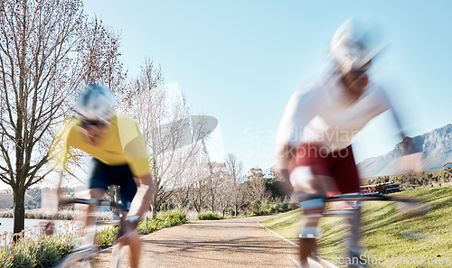 Image of Race, cycling and speed with men in park for training, motion blur and cardio workout. Marathon, sports and exercise with cyclists riding on bike for fast, challenge and fitness for competition