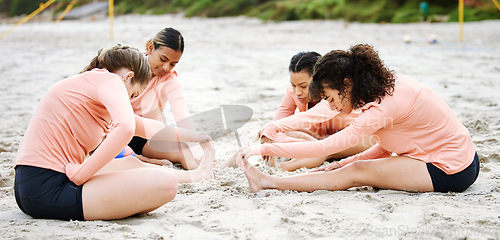 Image of Beach, volleyball and women stretching legs ready to play match, competition and sports games. Teamwork, fitness and female players stretch body for warm up practice, training and exercise on sand