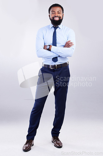 Image of Portrait, success and black man with arms crossed, employee and happiness against a studio background. Face, African American male entrepreneur and consultant with skills, management and leadership