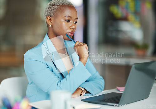 Image of Laptop, thinking and a business black woman at work in her office on a review, proposal or project. Serious, focus and idea with a female employee reading an email or doing research while working