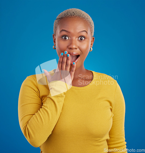 Image of Shocked, surprise and portrait of black woman in studio for good news, announcement and wow. Secret, rumor and gossip with female isolated on blue background for amazing, satisfaction and deal