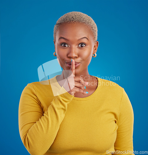 Image of Shush, secret and portrait of black woman in studio for secret, announcement and news. Silence, mystery and privacy with female isolated on blue background for rumor, gossip and confidential