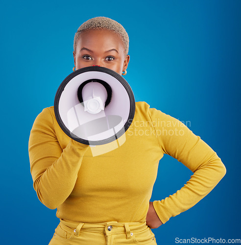 Image of Megaphone, protest and speaker with black woman in studio for change, democracy and opinion. Vote, announcement and message with female isolated on blue background for empowerment, strike and choice