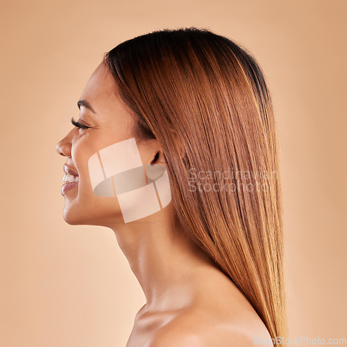 Image of Woman, beauty and hair care profile with a smile for growth and shine shampoo on a brown background. Aesthetic female happy in studio for natural keratin treatment and wellness with color and texture