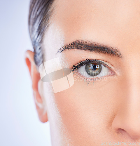 Image of Closeup, portrait and woman with skincare, cosmetics and dermatology against a studio background. Face, female and lady with grooming, zoom and treatment with natural care, eye and morning routine