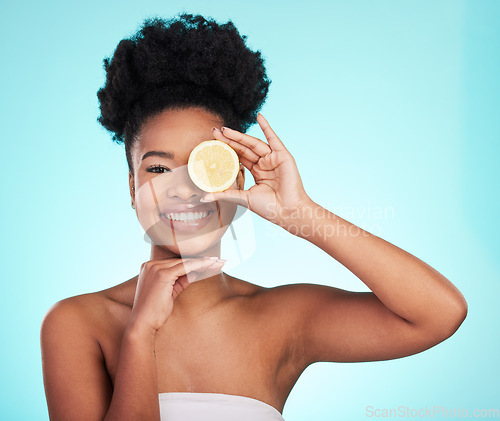 Image of Lemon, skincare and portrait of black woman in studio smile for wellness, natural cosmetics and facial. Dermatology spa, beauty and face of girl with citrus fruit for detox, vitamin c and nutrition