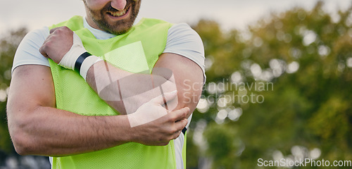 Image of Rugby, pain and man with arm injury on sports field after practice match, training and game outdoors. Medical emergency, accident and male athlete with joint inflammation, elbow sprain and tendinitis