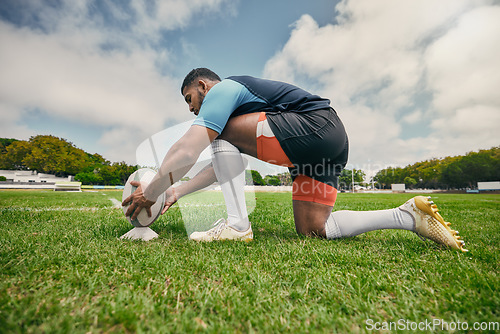 Image of Rugby kick, sports man or ball in training game, practice workout or match on stadium field outdoors. Fitness, ready or athlete player in action playing in cardio exercise on grass in France, Paris