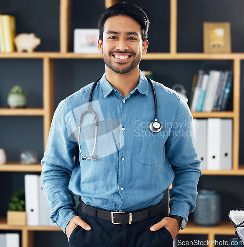 Image of Happy, medicine and portrait of an Asian doctor for consultation, healthcare and medical help. Smile, hospital and a friendly male clinic worker ready for surgery, gp work and nursing in an office