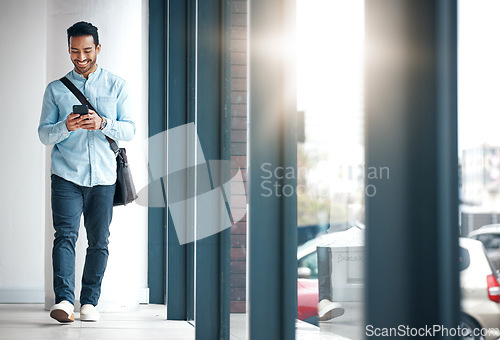 Image of Professional man with phone, communication with typing or scroll through social media with smile. Happy young male, reading text and contact with network, technology and creative employee at startup