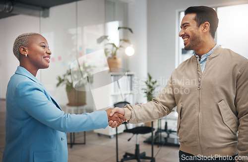 Image of Business people, handshake and partnership in collaboration for trust, unity or teamwork at the office. Businessman and woman shaking hands in meeting, b2b or agreement for greeting, welcome or deal