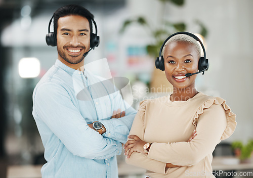Image of Business people, call center and portrait smile with arms crossed for teamwork collaboration in customer service at the office. Happy asian man and black woman consultant smiling for online advice