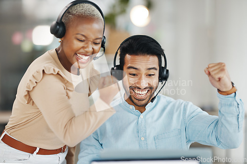 Image of Asian man, call center and team celebration for winning, bonus or discount sale on laptop in telemarketing at office. Happy and excited male consultant with colleague for win, victory or promotion