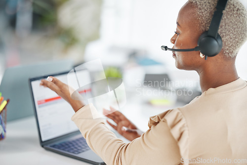 Image of Black woman, call center and consulting with headphones on laptop for customer service or support at office desk. African American female consultant agent talking on computer with headset for advice